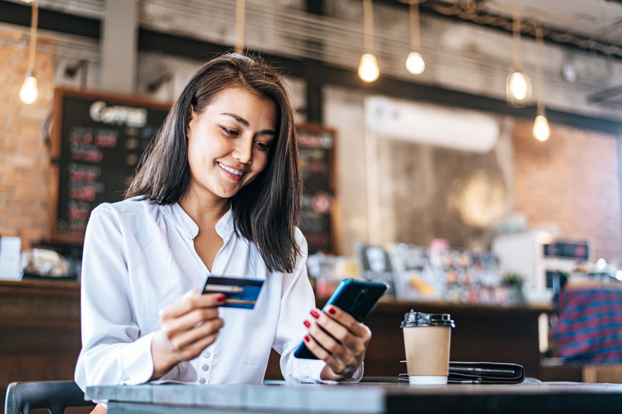 62def32e92a2a5830cea04e1_pay-goods-by-credit-card-through-smartphone-coffee-shop Digital Transformation in Banking: Why It’s Time